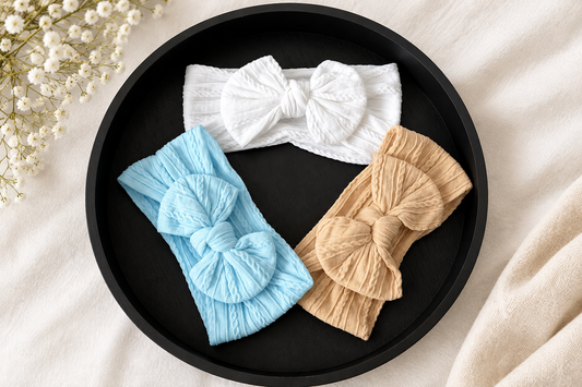 Beau’s small bow headband in ice white. 
